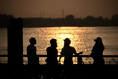 AI generated people looking at sea silhouette - ocean view art