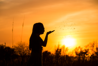AI generated women with sun silhouette - nature art